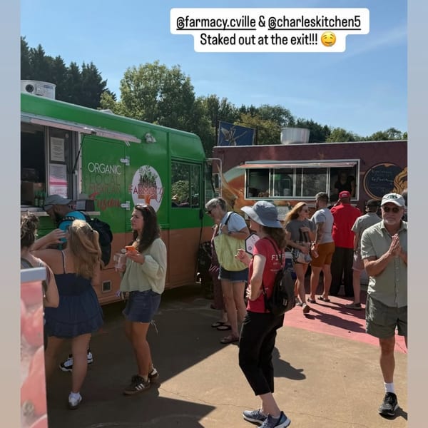 People queueing at the Farmacy Cafe food truck, which serves organic local Mexican fusion cuisine.